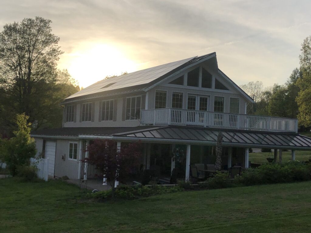 Sunset behind home with new solar array